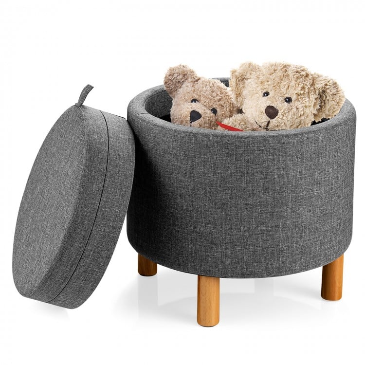 Round gray fabric storage ottoman with removable lid, wooden tray, and plush toys inside, perfect for bedroom.