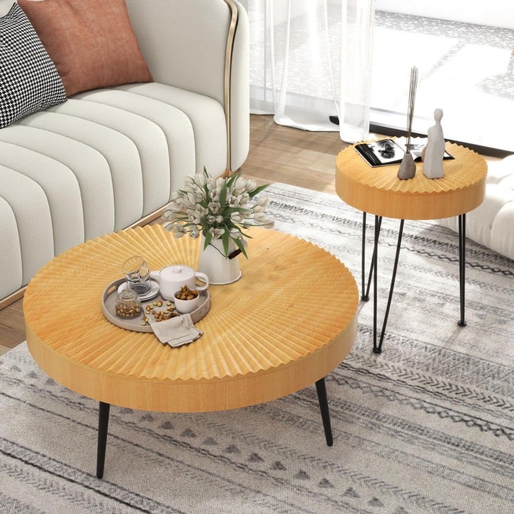 Two wooden coffee tables with radial pattern, solid wood tops, and metal legs, perfect for living room decor.