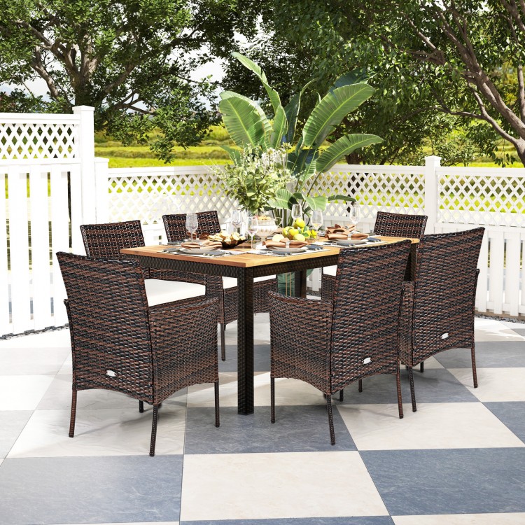 Outdoor dining set featuring 2 PE rattan armchairs with removable waterproof cushions, perfect for patio or garden use.