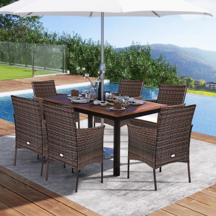 Outdoor PE rattan armchairs with removable waterproof cushions, featuring a widened backrest and curved armrests for.