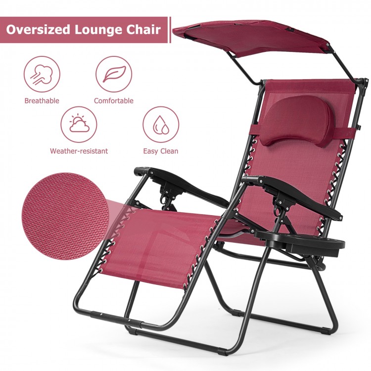 Oversized folding recliner lounge chair in wine color with adjustable shade canopy, cup holder, and durable steel frame.