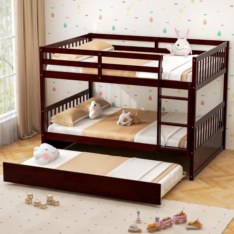 Full over full bunk bed in brown wood with trundle, featuring sturdy pine frame and guardrails for kids' safety.