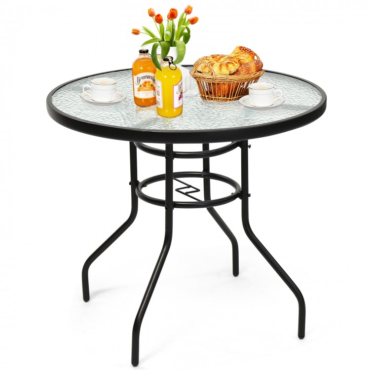 Round 32-inch patio table with tempered glass top and black steel frame, featuring an umbrella hole for outdoor dining.