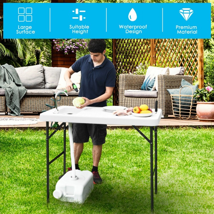 Folding cleaning sink table with sprayer, durable plastic, portable design for outdoor cleaning and cooking tasks.