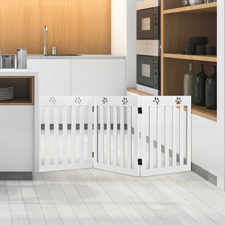 Freestanding 24-inch white wooden dog gate with 360° hinges, ideal for kitchen and doorway safety for small pets.