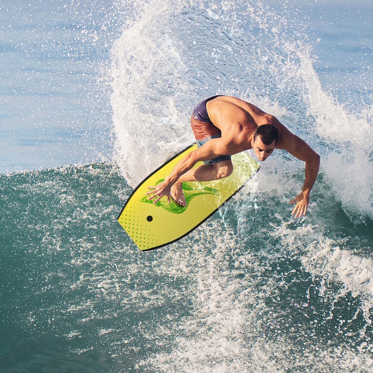 A surfer riding a wave on a bright yellow Super Lightweight Bodyboard-M, designed for durability and buoyancy.
