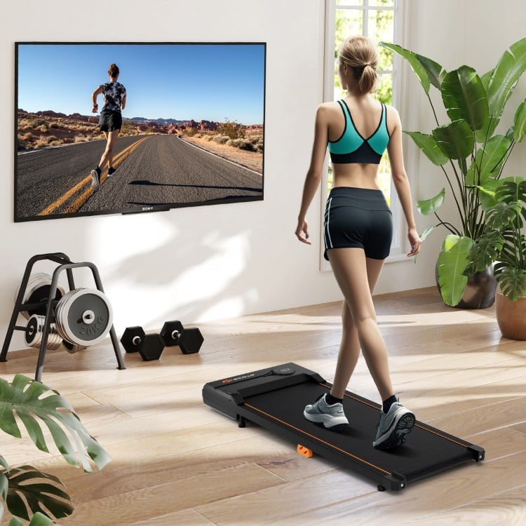 Under desk treadmill in use, featuring a 2.5HP motor, anti-slip running belt, and remote control for home office.