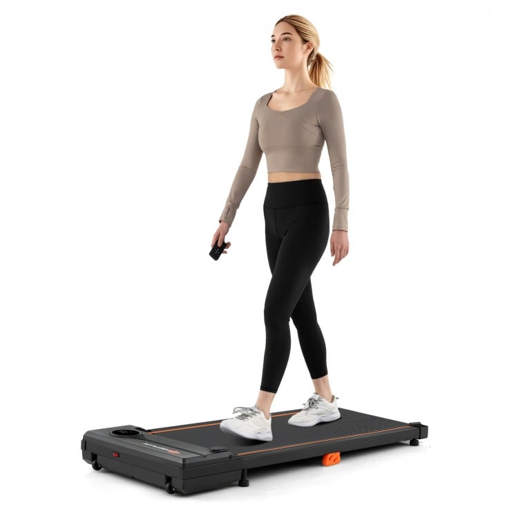 Compact 2.5HP under desk treadmill in black, featuring remote control and anti-slip running belt for home office use.