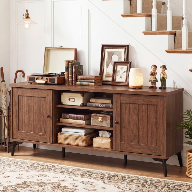 Mid-century modern 2-door TV stand in brown, featuring adjustable shelves and sturdy metal legs for TVs up to 65 inches.
