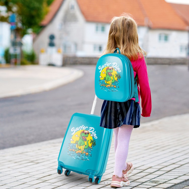 Kid walking with a blue hardshell suitcase and matching backpack featuring a playful dinosaur design for travel.