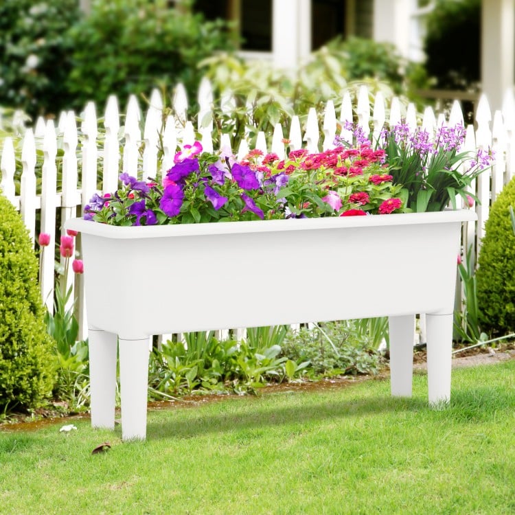 Self-watering raised garden bed in white, featuring detachable legs and drainage hole, ideal for flowers and vegetables.