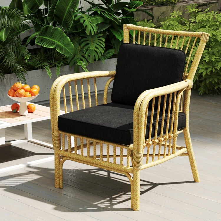Black outdoor patio chair with removable cushion, crafted from breathable olefin fabric for comfort and durability.