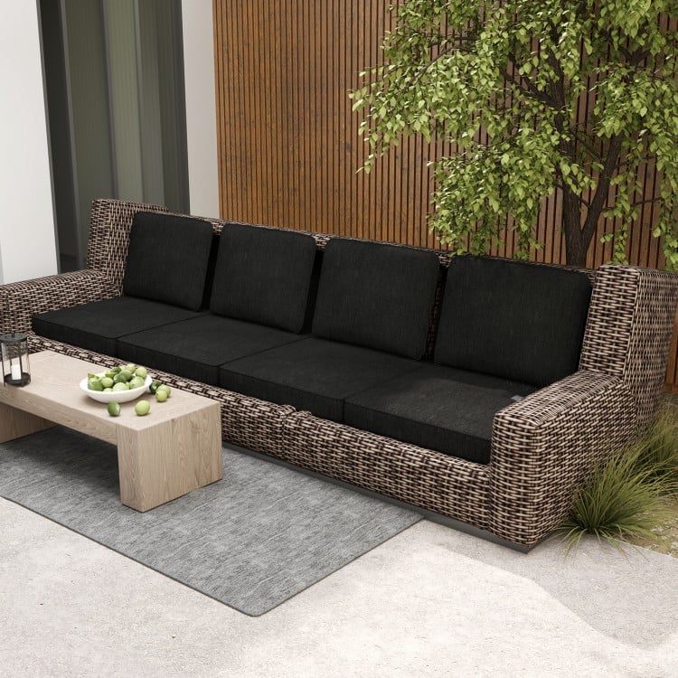 Black outdoor patio sofa with plush cushions, crafted from breathable olefin fabric for comfort and durability.