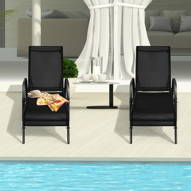 Two adjustable outdoor patio lounge chairs in black fabric, perfect for poolside relaxation and easy transport.