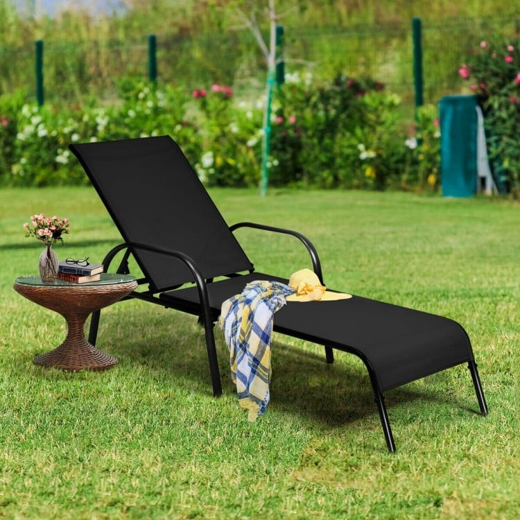 Black outdoor patio lounge chair with adjustable reclining armrest, perfect for poolside relaxation and backyard use.