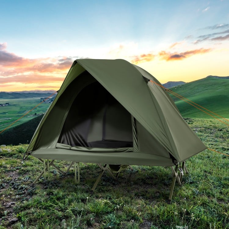 Foldable 2-person camping cot tent in green, elevated design for outdoor use, ideal for camping and backyard trips.