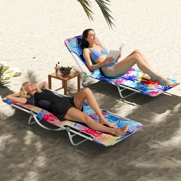Two women relaxing on vibrant pink beach recliners with adjustable backrests, perfect for poolside or beach use.