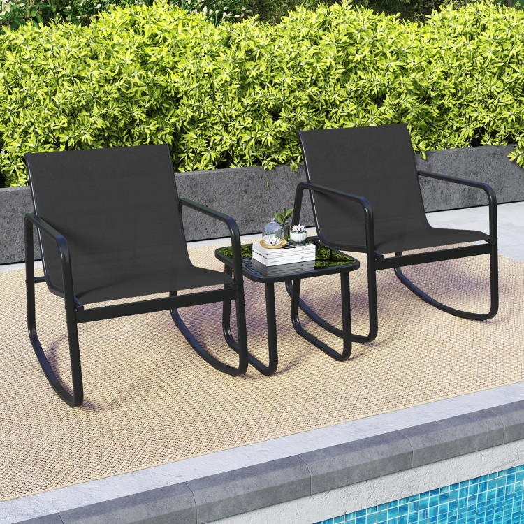 Two black rocking bistro chairs with a glass-top table, perfect for relaxing on the porch or poolside.