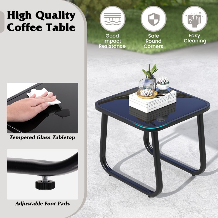 Black glass-top coffee table with adjustable foot pads, featuring a tempered glass surface for easy cleaning and.