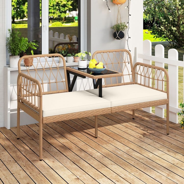 2-seat PE rattan outdoor loveseat with built-in coffee table and soft white cushions, perfect for patios and backyards.