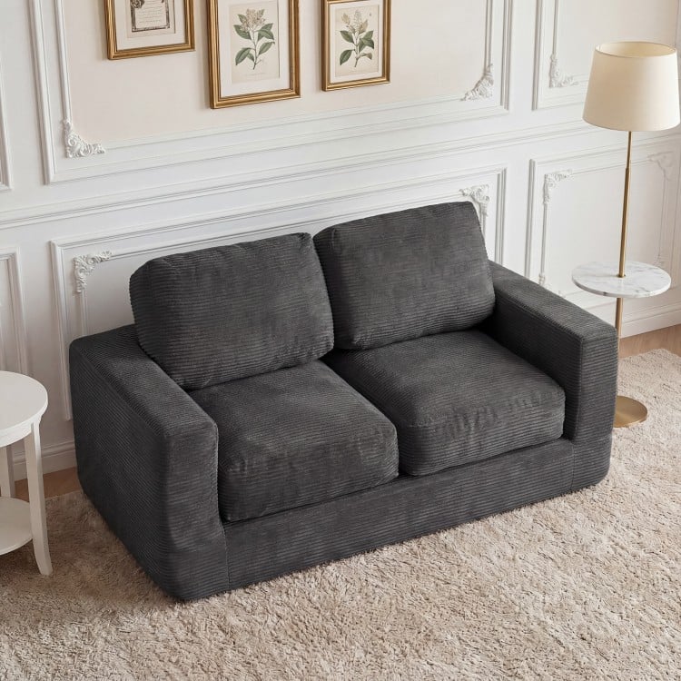 Black 2-seater floor couch loveseat with removable corduroy cover, high-density foam, ideal for cozy lounging.