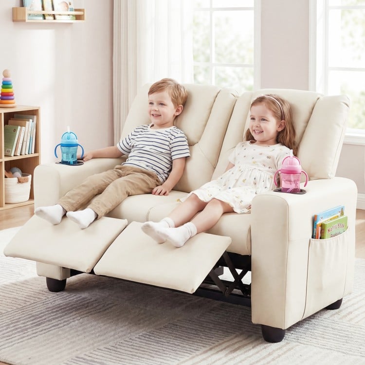 Beige 2-seater kids recliner sofa chair featuring two children enjoying the adjustable footrest and cup holders for.