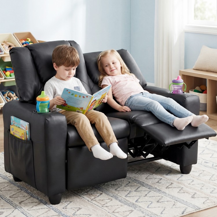 Kids enjoy reading on the black 2-seater recliner sofa chair with adjustable backrest and cup holders.