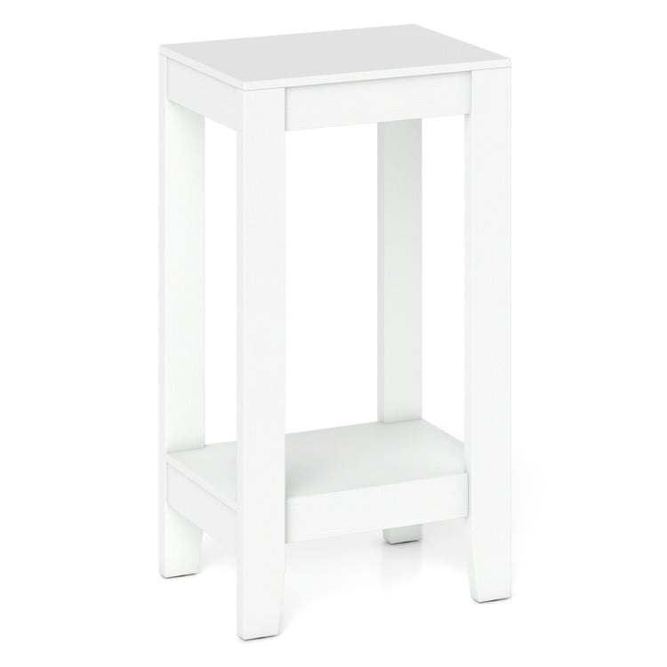 Sleek white 2-tier nightstand featuring solid wood legs and a minimalist design, perfect for enhancing bedroom decor.