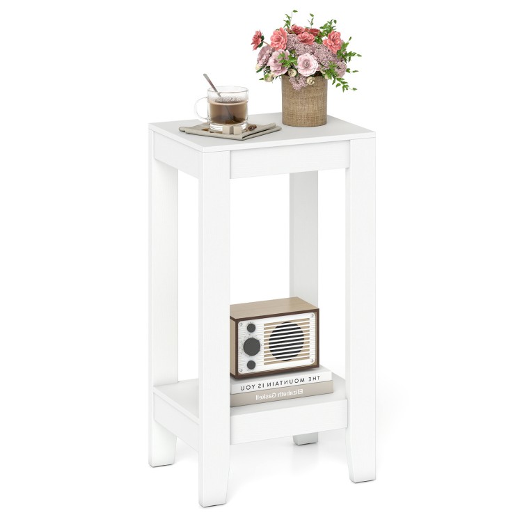 White 2-tier nightstand with solid wood legs, offering ample storage for bedroom or living room use.