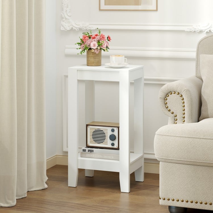 White 2-tier nightstand with solid wood legs, offering ample storage and a stylish design for bedroom or living room use.