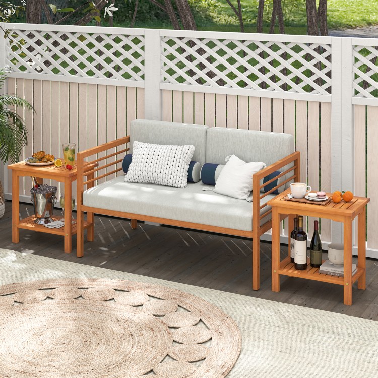 Acacia wood side table with slatted tabletop and storage shelf, perfect for patio or garden use.