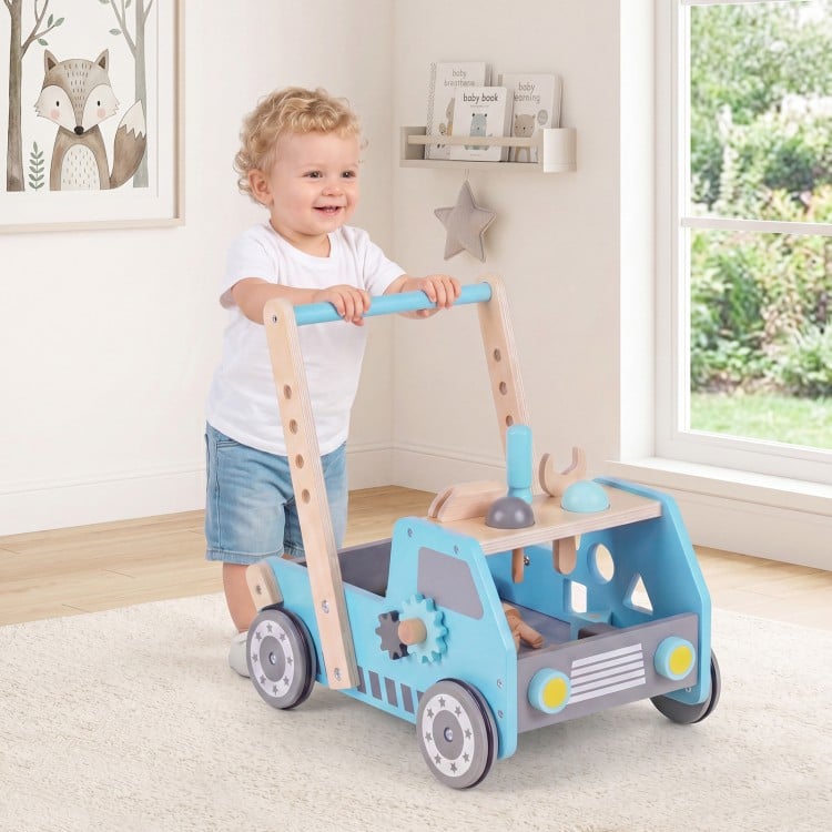 Wooden baby walker in blue with adjustable speed, storage, and truck shape, promoting walking and creativity for kids.