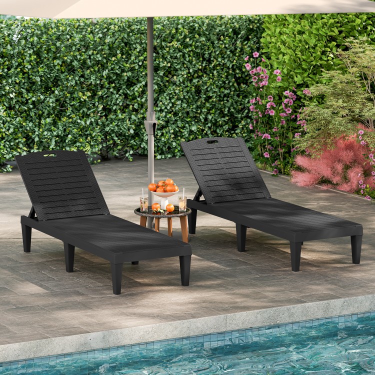 Set of 2 black outdoor PP chaise lounge chairs with adjustable backrests, ideal for poolside relaxation and sunbathing.