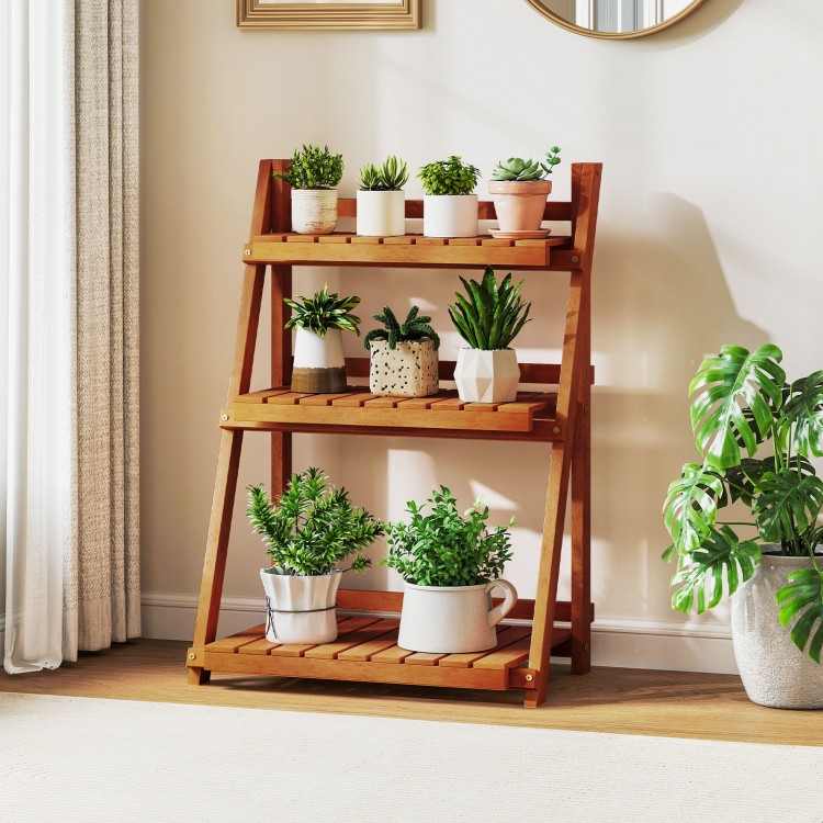 Foldable 3-tier solid wood plant stand with smooth shelves, ideal for potted plants and home decor in any setting.