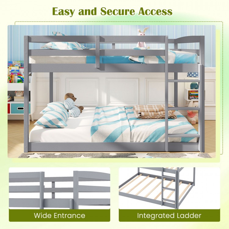 Full over full low-to-ground bunk bed in gray with integrated ladder and wide entrance for easy access and safety.
