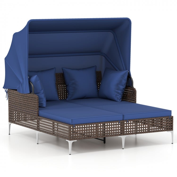 Outdoor daybed with retractable canopy in navy, featuring PE wicker rattan and cushioned seating for patio relaxation.
