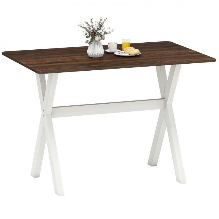 Modern dining table with a spacious wooden top and X-shaped white frame, ideal for kitchens and dining areas.