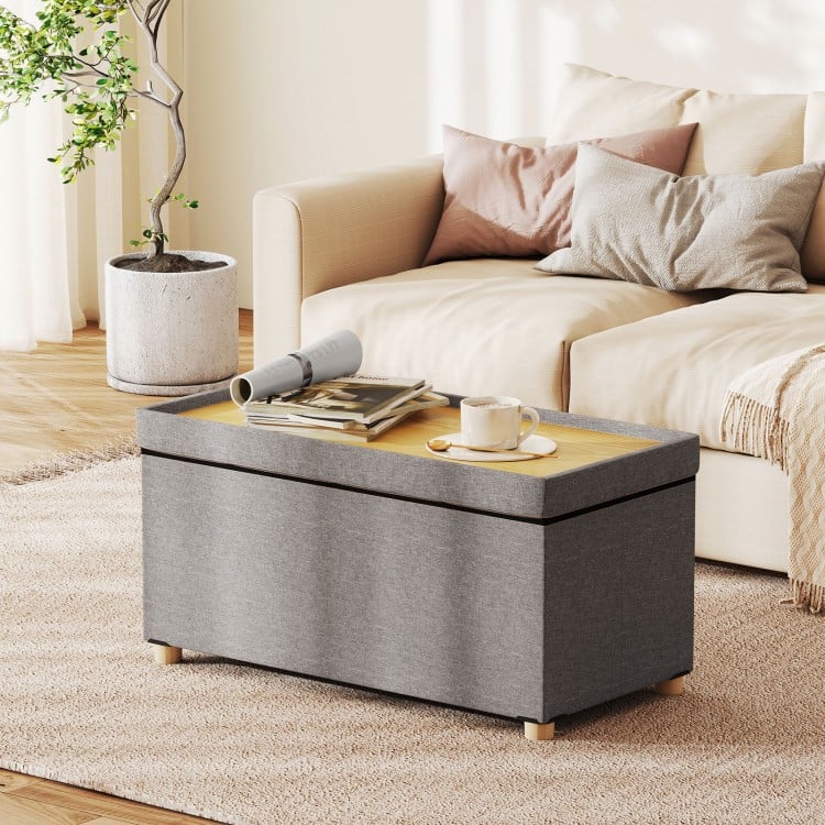 Gray storage ottoman bench with tray, rubber wood legs, and 20.5-gallon capacity, ideal for living rooms and bedrooms.