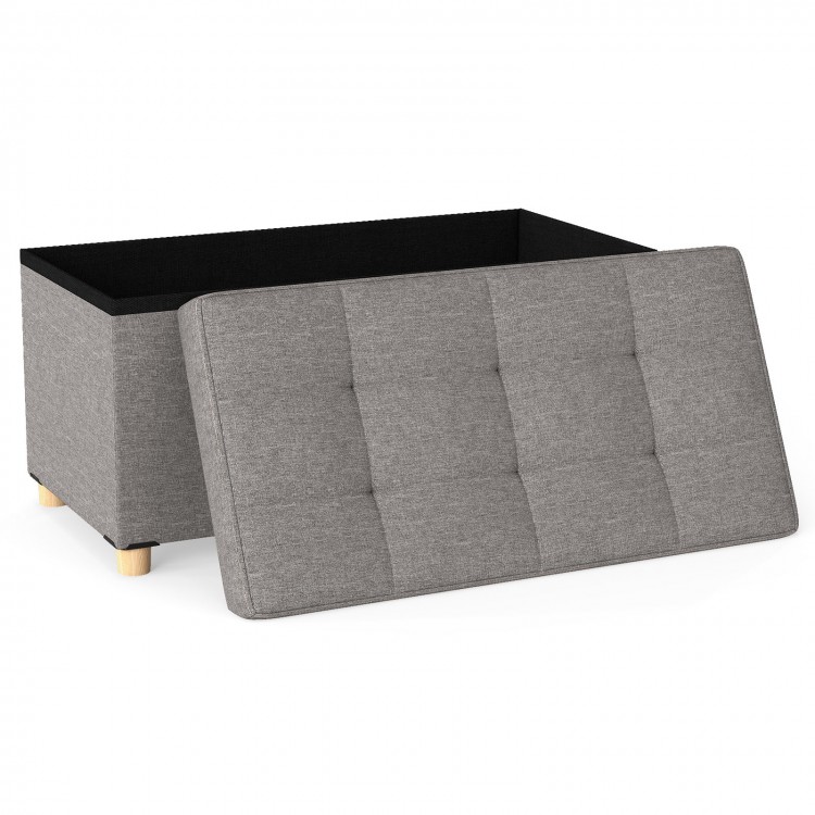 Gray storage ottoman bench with flip-over lid, rubber wood legs, and 20.5-gallon capacity for versatile home use.