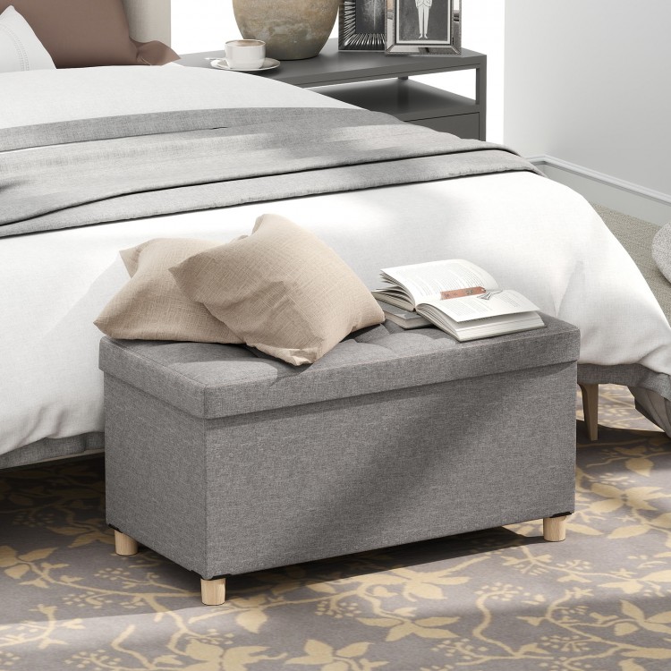 Gray storage ottoman bench with rubber wood legs, featuring a flip-over lid and 20.5-gallon capacity for versatile use.