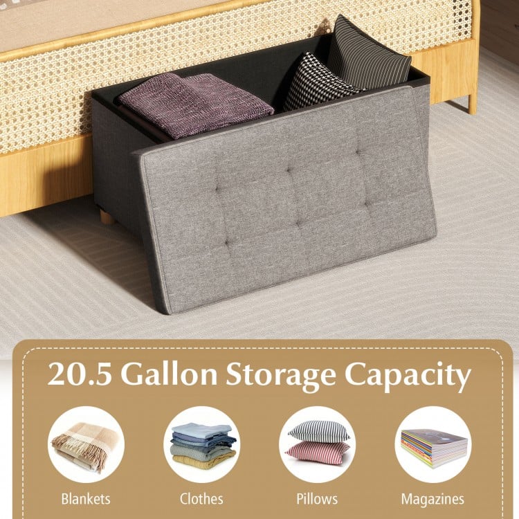 Gray storage ottoman bench with 20.5-gallon capacity, rubber wood legs, and flip-over lid for drinks and snacks.