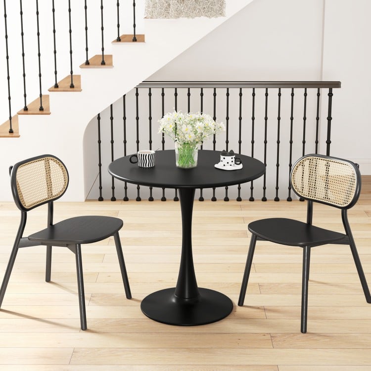 Round black dining table with a 31.5" tabletop and anti-slip PP ring, perfect for dining rooms or cafes.