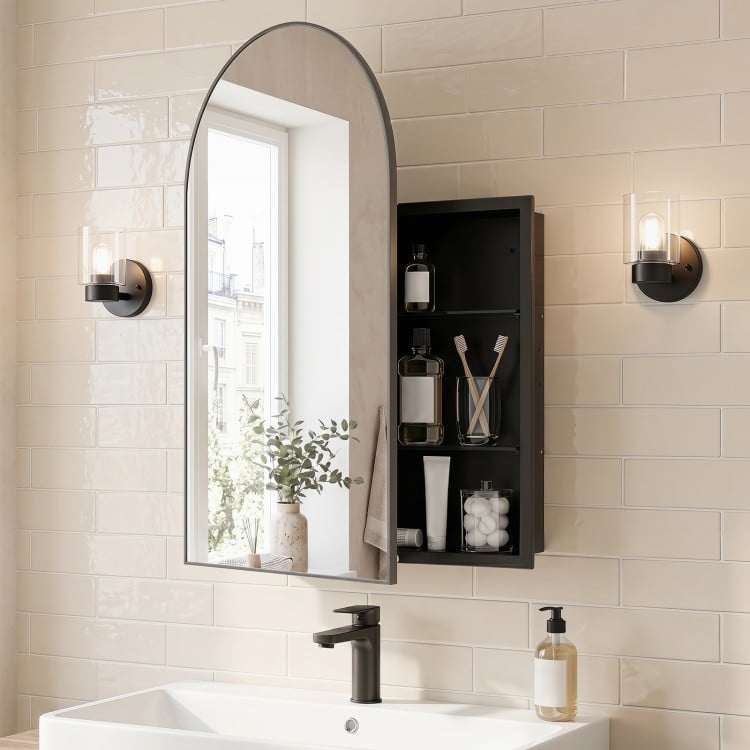 Brushed metal wall-mounted storage cabinet with arched mirror and adjustable shelves for elegant bathroom organization.