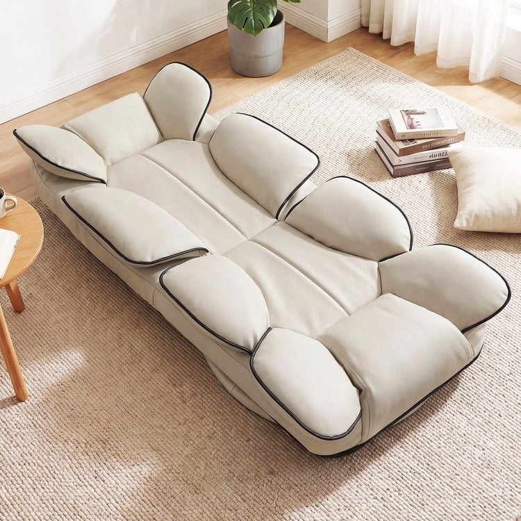 Beige 360° swivel floor gaming chair with adjustable backrest, sponge filling, and ergonomic support for gaming and.