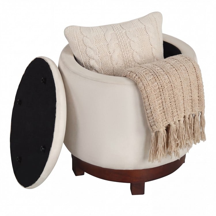 Beige 360° swivel velvet footrest with hidden storage, featuring a cozy blanket and pillow, perfect for living room use.