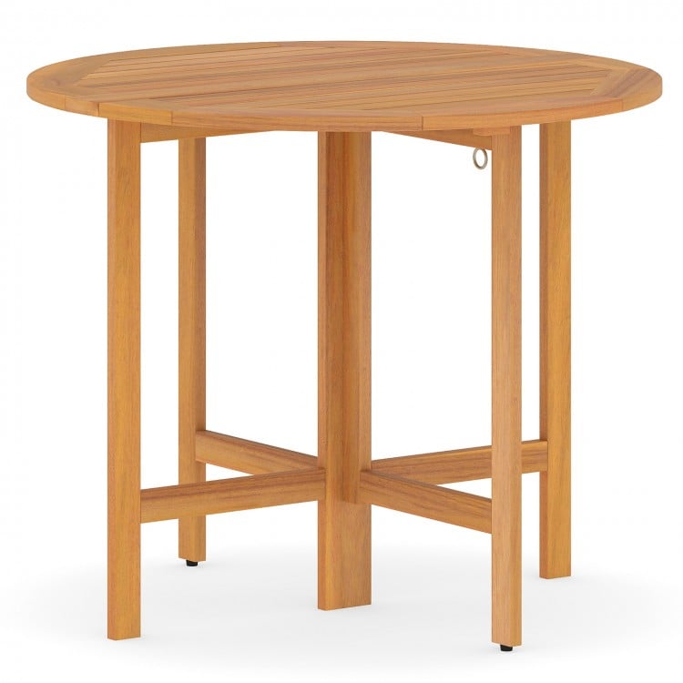Round 36-inch outdoor folding dining table made of acacia wood, featuring a slatted tabletop for backyard gatherings.