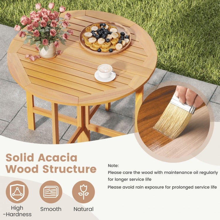 36-inch outdoor folding round dining table made of acacia wood, featuring a slatted tabletop for backyard gatherings.