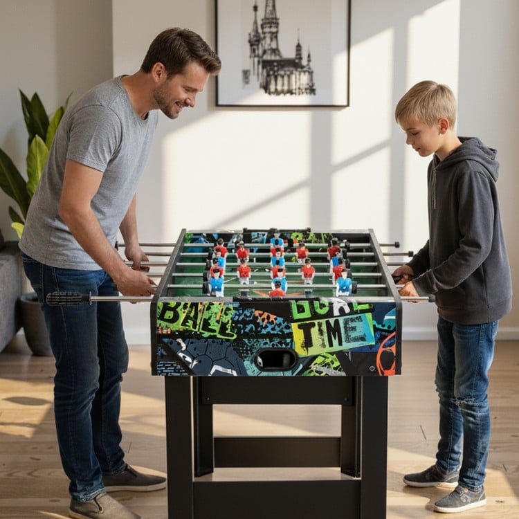 Two players enjoying the 37 Inch Mini Foosball Table with vibrant graphics, showcasing its 2-in-1 tabletop design.