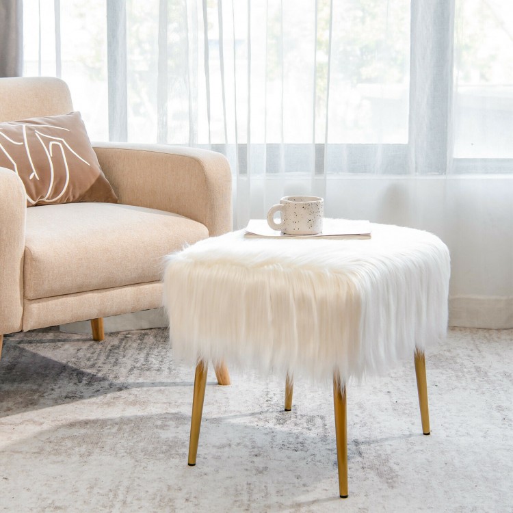 Faux fur vanity stool with golden metal legs, offering comfort and style for makeup rooms or as a footrest.