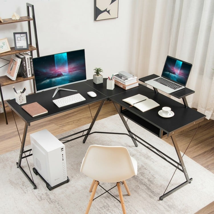 L-shaped black computer desk with movable monitor stand, spacious tabletop, and pull-out keyboard tray for home office.